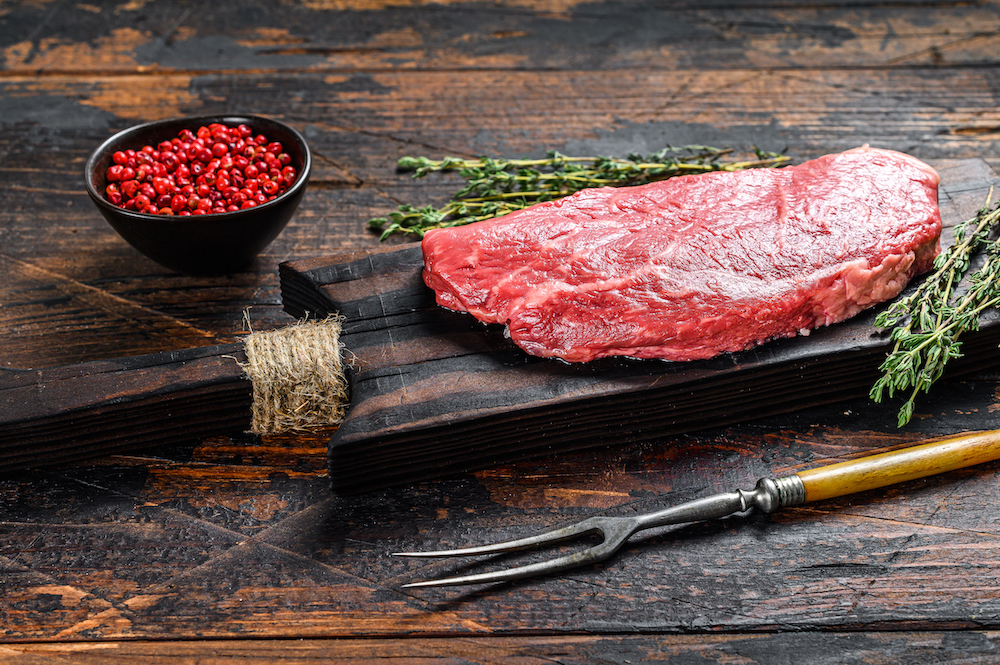 aw-striploin-steak-on-a-cutting-board-after-going-through-an-rmf-challenge-vacuum-marinater